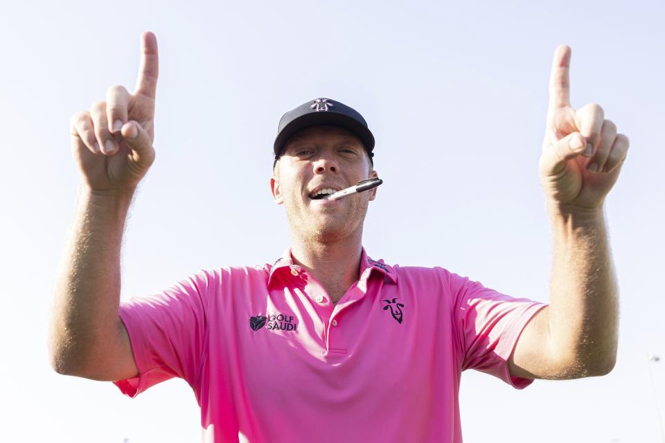 LIV Golf Jeddah Second Place finisher, Talor Gooch, of RangeGoats GC, celebrates after the LIV Golf Jeddah tournament at the Royal Greens Golf & Country Club on Sunday, Oct. 15, 2023, in King Abdullah Economic City, Saudi Arabia. (Chris Trotman/LIV Golf via AP)