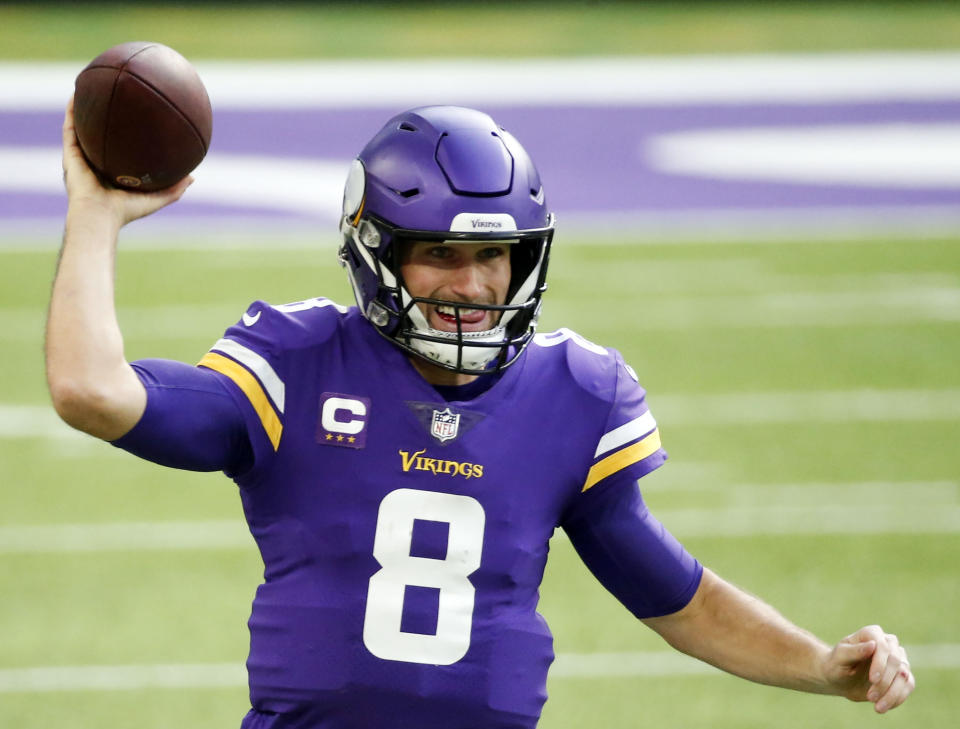 FILE - In this Dec. 20, 2020, file photo, Minnesota Vikings quarterback Kirk Cousins throws a pass during an NFL football game against the Chicago Bears in Minneapolis. Even during a pandemic with ticket sales limited and the off-the-field events drastically scaled back, an event like the Super Bowl also brings with it a heightened risk of human trafficking. Cousins is among a handful of NFL players who’ve joined the cause to help fight such atrocities. (AP Photo/Bruce Kluckhohn, File)