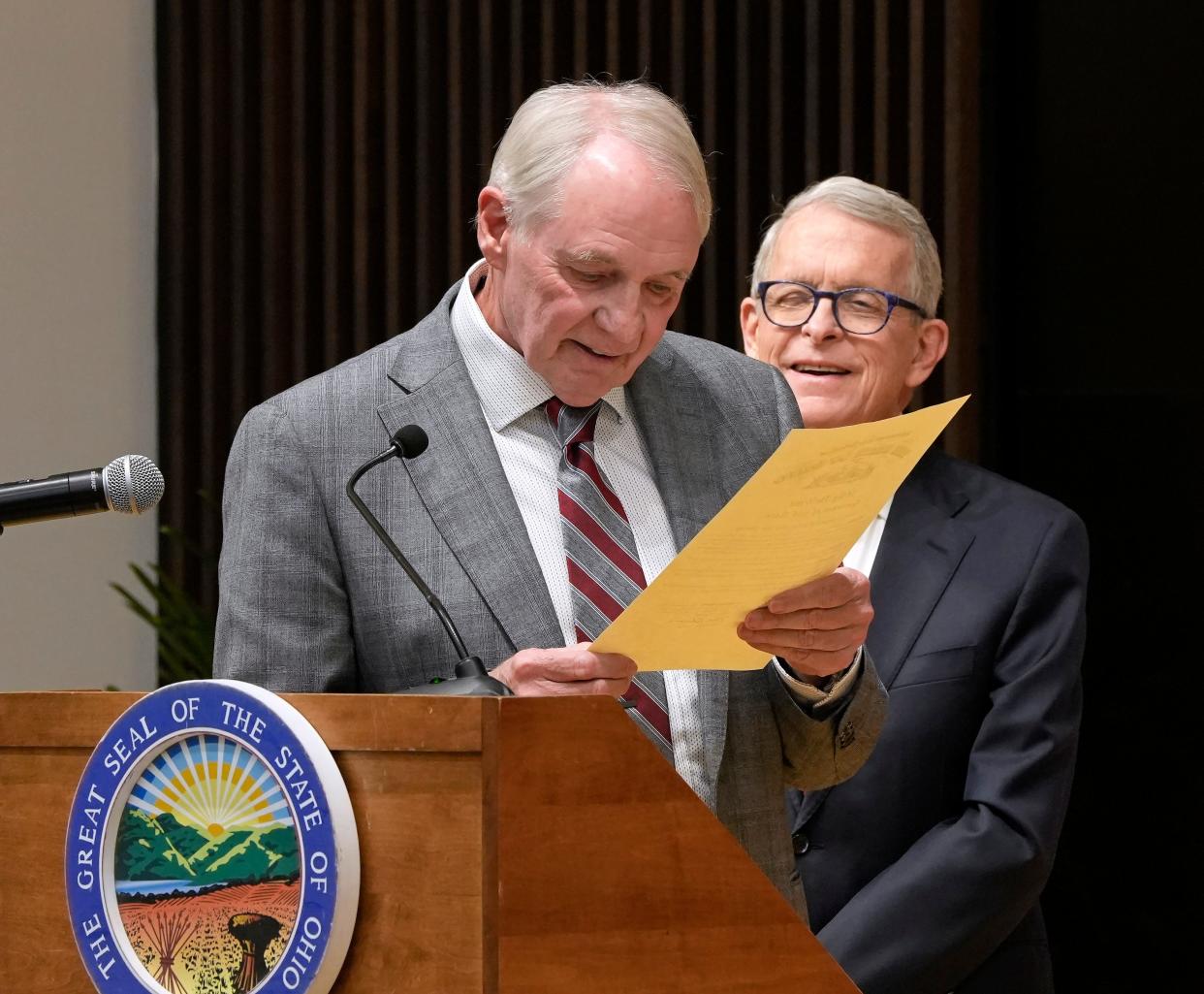 Dec. 20, 2023; Columbus, Ohio, USA; 
Richard Hill reads from the pardon he received during an event Wednesday at the Ohio State University Moritz College of Law where Ohio Governor Mike DeWine announced that the expedited pardon project surpassed 100 people in the four years since it was created.