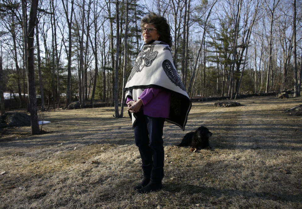 In this March 27, 2019, photo, author Shoshana Zuboff pauses while walking her dog near her home in Maine. Zuboff is the author of "The Age of Surveillance Capitalism," a book about how tech companies collect and use personal data. (AP Photo/Robert F. Bukaty)