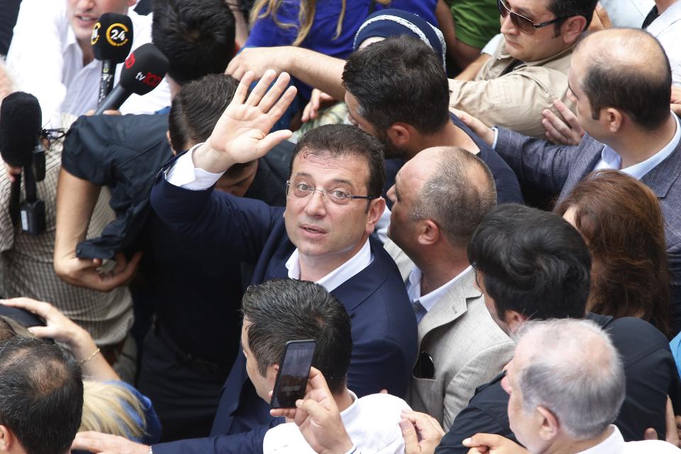 Ekrem Imamoglu, candidate of the secular opposition Republican People's Party, or CHP waves to their supporters outside a polling station in Istanbul, Sunday, June 23, 2019. Voters in Istanbul returned to the polls Sunday for a re-run mayoral election ordered up by authorities after President Recep Tayyip Erdogan and his political allies lost control of Turkey's largest city for the first time in 25 years. (AP Photo/Lefteris Pitarakis)