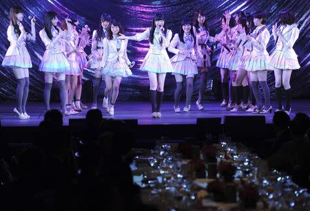 Japanese girls' pop group AKB48, led by Rino Sashihara (C), performs on the stage during a gala dinner of the ASEAN-Japan Commemorative Summit meeting hosted by Japan's Shinzo Abe (not in picture), in Tokyo December 14, 2013 file photo. REUTERS/Toshifumi Kitamura/Pool/Files