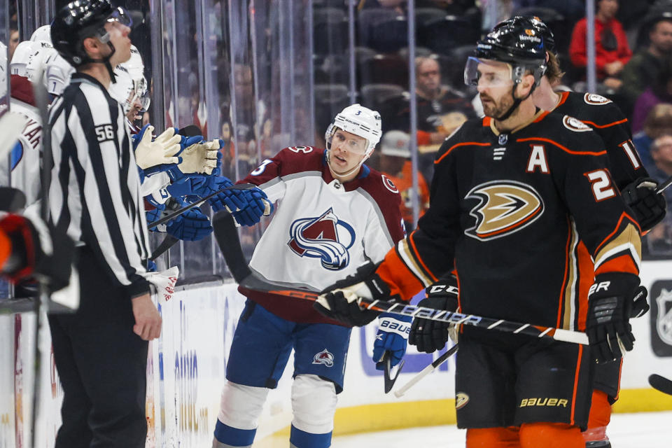 Colorado Avalanche defenseman Jack Johnson, center, is congratulated after his goal during the second period of an NHL hockey game against the Anaheim Ducks in Anaheim, Calif., Monday, March 27, 2023. (AP Photo/Ringo H.W. Chiu)