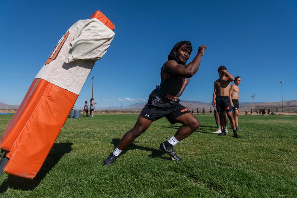 Apple Valley's Zyron Belcher participates in a drill during a recent summer football practice at the school. Apple Valley begins the season at home against Eastlake on Aug. 18.