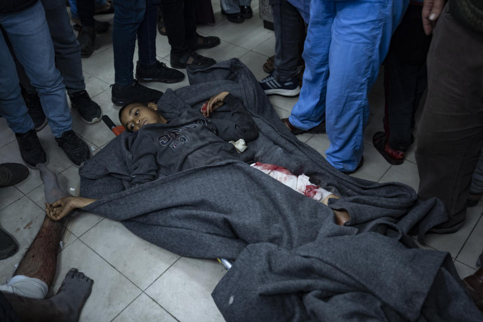 Palestinians wounded in Israeli bombardment of the Gaza Strip are brought to a hospital in Rafah, southern Gaza on Wednesday, Jan. 24, 2024. (AP Photo/Fatima Shbair)