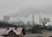 In this Nov. 21, 2018 photo smoke billows from chimney stacks of the heating and power plant in Bedzin, near Katowice, Poland. The COP 24 UN Climate Change Conference is taking place in Katowice. Negotiators from around the world are meeting for talks on curbing climate change. (AP Photo/Czarek Sokolowski)