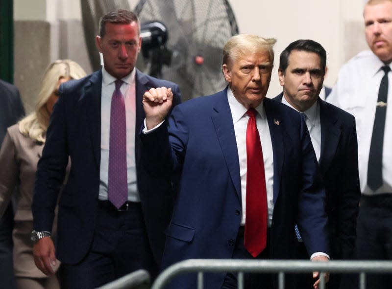 NEW YORK, NEW YORK - APRIL 23: Former U.S. President Donald Trump gestures as he returns to court for his trial for allegedly covering up hush money payments at Manhattan Criminal Court on April 23, 2024 in New York City. Former U.S. President Donald Trump faces 34 felony counts of falsifying business records in the first of his criminal cases to go to trial. - Photo: Brendan McDermid-Pool (Getty Images)