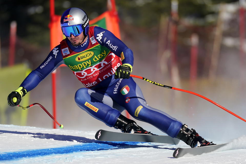 CORRECTS TO SUPER-G NOT DOWNHILL - Dominik Paris, of Italy, moves down the course during the men's World Cup super-G ski race in Lake Louise, Alberta, Sunday, Dec. 1, 2019. (Frank Gunn/The Canadian Press via AP)