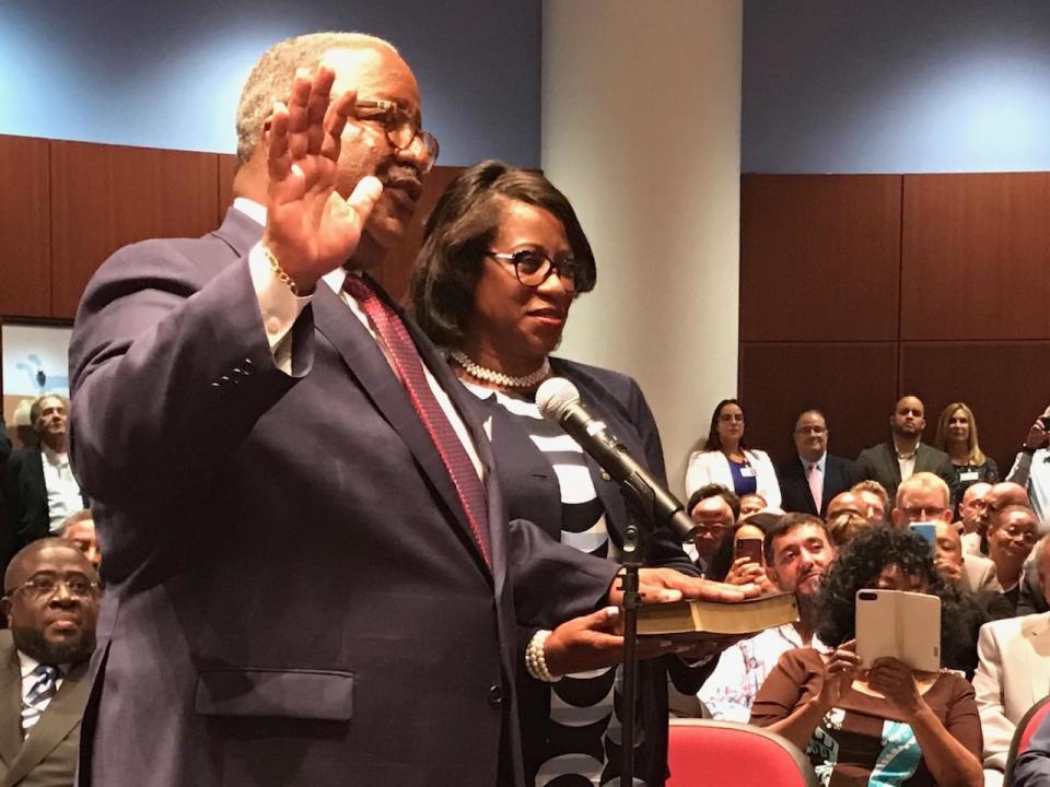 Keith James and his wife, Lorna, seen here when he was sworn in as mayor in April 2019, are both traveling to Dubai.