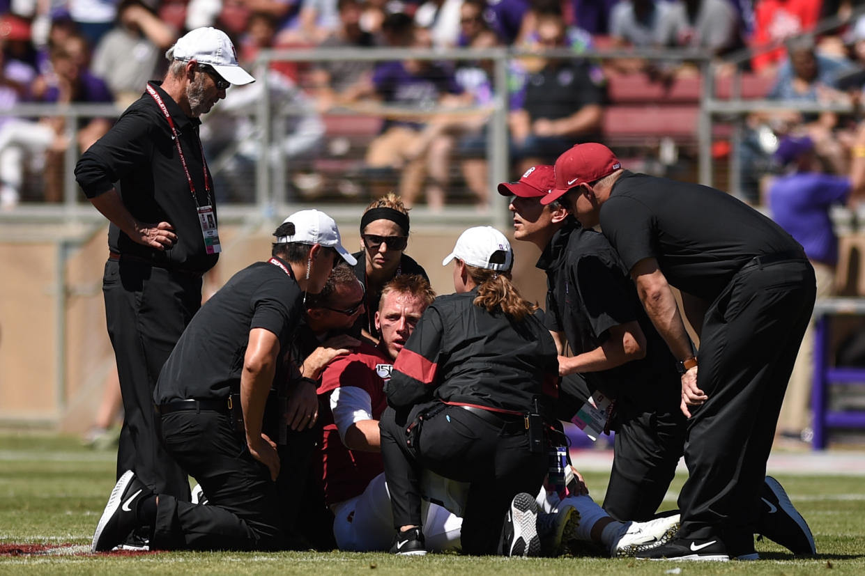 PALO ALTO, CA - AUGUST 31: Stanford Cardinal quarterback K.J. Costello (3) is attended to by medical staff after sustaining an injury during the college football game between the Northwestern Wildcats and the Stanford Cardinal at Stanford Stadium on August 31, 2019 in Palo Alto, CA. (Photo by Cody Glenn/Icon Sportswire via Getty Images)