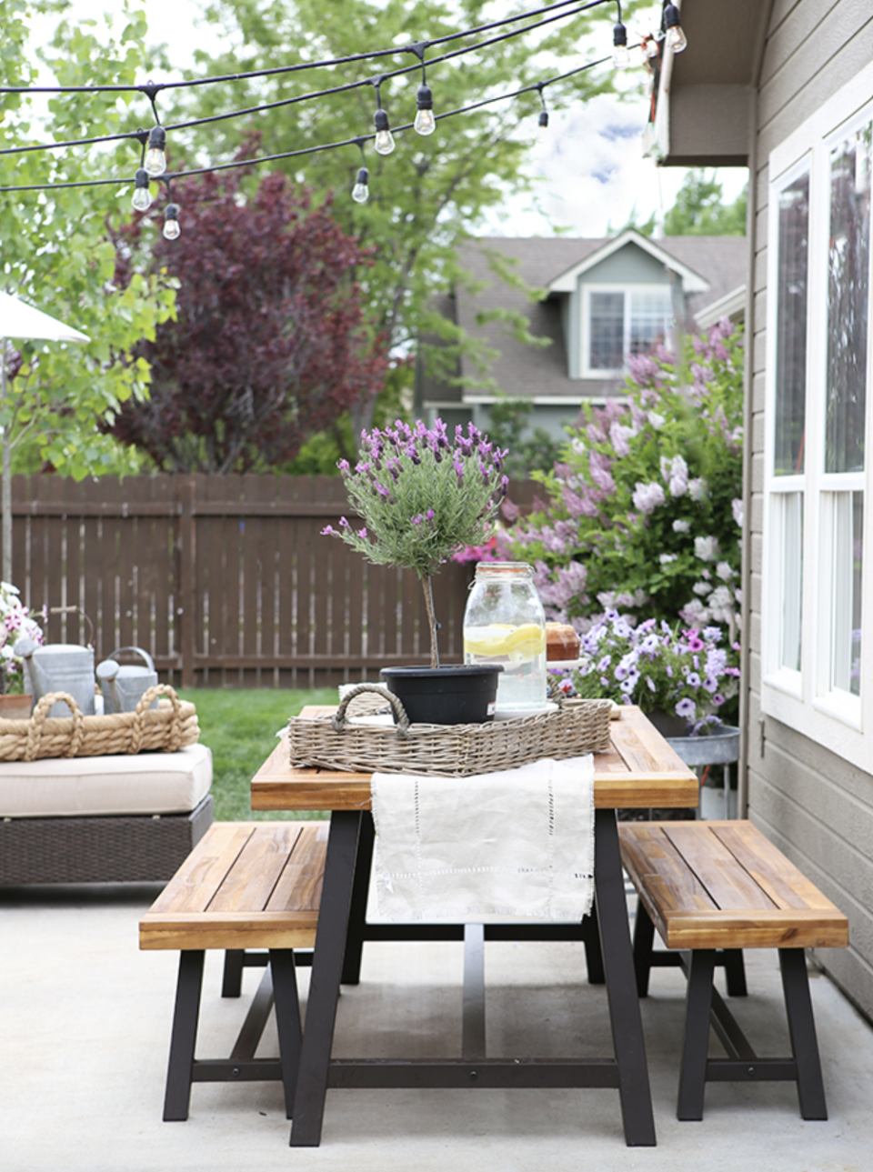 <p>Host your next garden party in style. A few strands of string lights create a tent-like effect above this outdoor dining table setup that's perfect for spring.</p><p><strong>See more at <a href="https://www.ellaclaireinspired.com/summer-patio-makeover-tour/" rel="nofollow noopener" target="_blank" data-ylk="slk:Ella Claire;elm:context_link;itc:0;sec:content-canvas" class="link ">Ella Claire</a>.</strong></p><p><a class="link " href="https://go.redirectingat.com?id=74968X1596630&url=https%3A%2F%2Fwww.wayfair.com%2Fkeyword.php%3Fkeyword%3Doutdoor%2Bdining%2Bsets&sref=https%3A%2F%2Fwww.countryliving.com%2Fgardening%2Fnews%2Fg3404%2Fbackyard-string-lights%2F" rel="nofollow noopener" target="_blank" data-ylk="slk:SHOP OUTDOOR DINING SETS;elm:context_link;itc:0;sec:content-canvas">SHOP OUTDOOR DINING SETS</a></p>