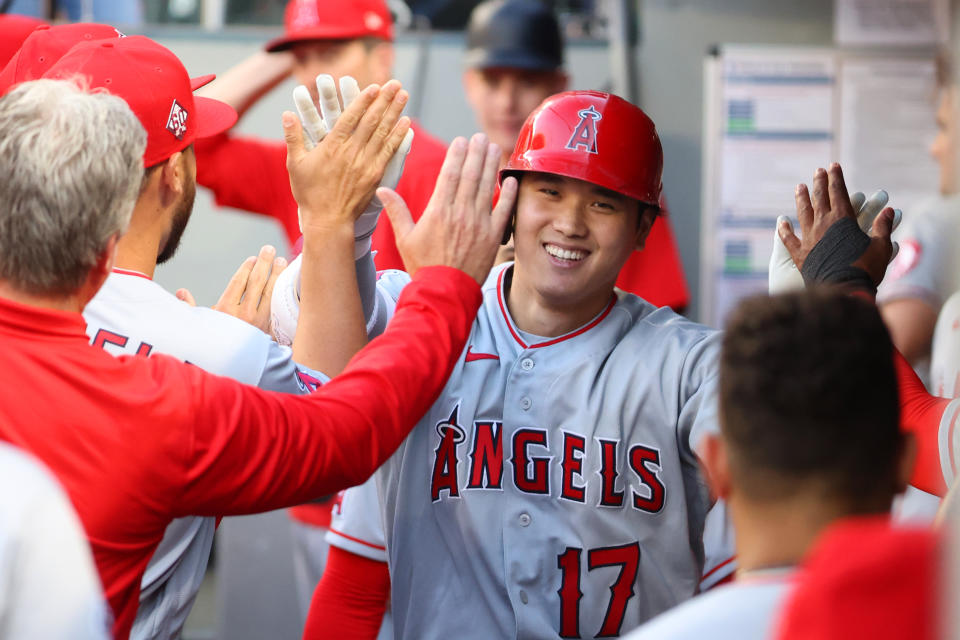 SEATTLE, WASHINGTON - JULY 09: Shohei Ohtani #17 of the Los Angeles Angels celebrates in the dugout after hitting a solo home run during the third inning against the Seattle Mariners at T-Mobile Park on July 09, 2021 in Seattle, Washington. (Photo by Abbie Parr/Getty Images)