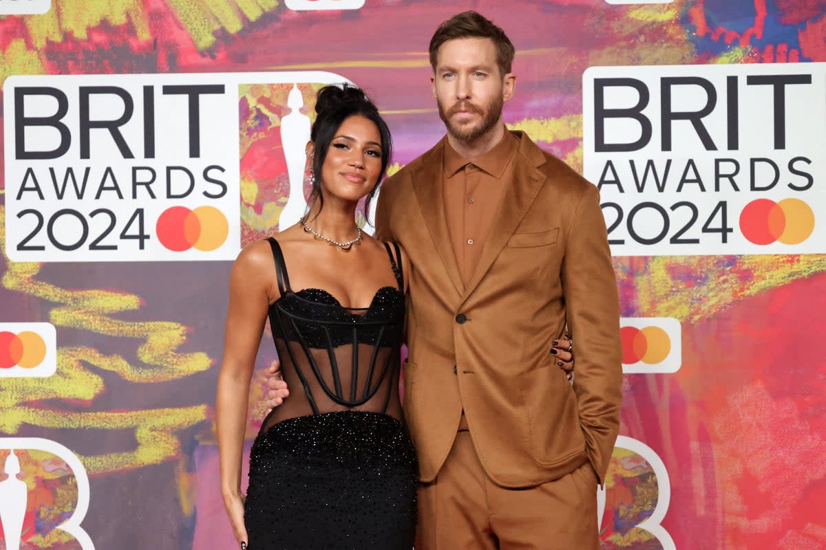 Vick Hope with Calvin Harris at 2024’s Brit Awards (AFP via Getty Images)
