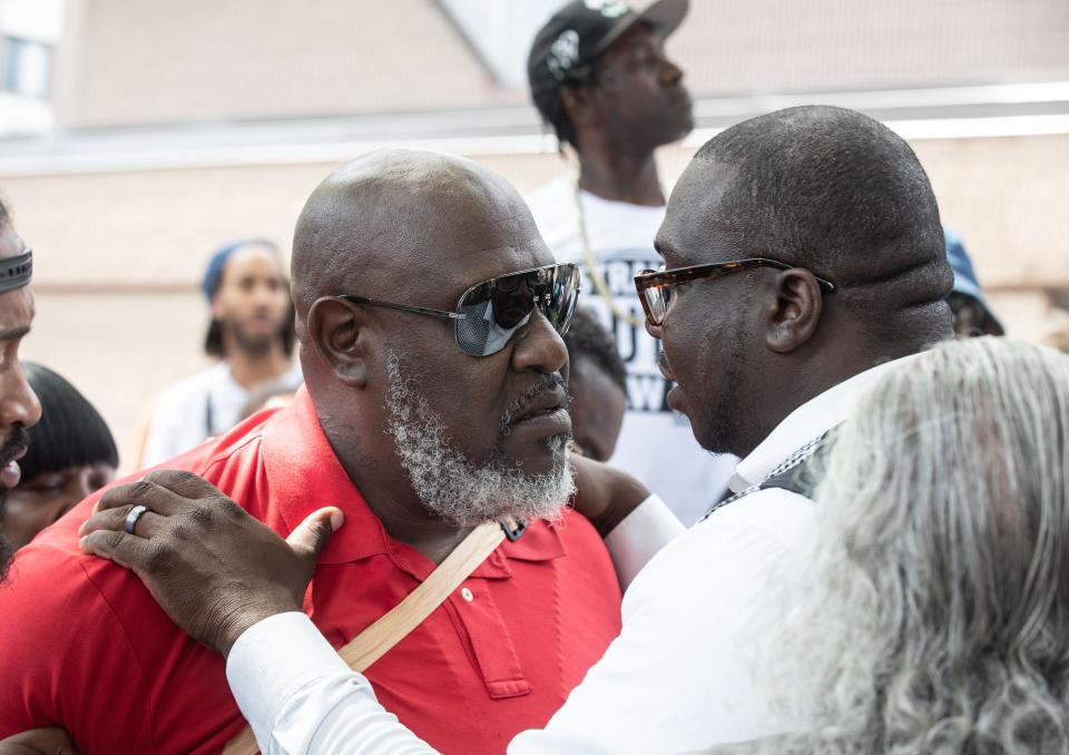 Raymond Fowler, left, the father of Jarrell Garris, is comforted by family spokesperson Rev. Kevin McCall before Fowler spoke to the media about the shooting of Garris by New Rochelle police this past Monday. Garris was shot by police during a scuffle on Lincoln Ave. in which police were attempting to arrest him after a nearby market called the police about Garris possibly stealing food.