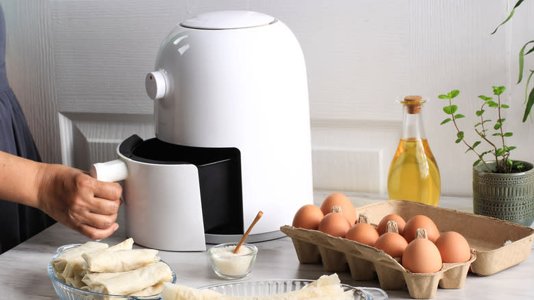 air fryer with carton of eggs