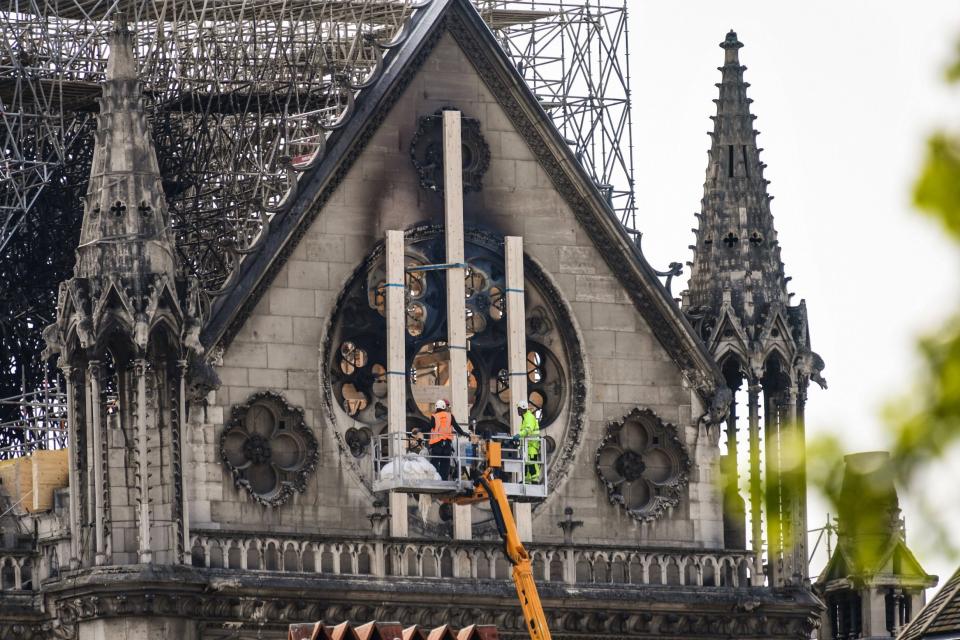 Workers set to secure vulnerable sections of the fire-damaged landmark (AFP/Getty Images)