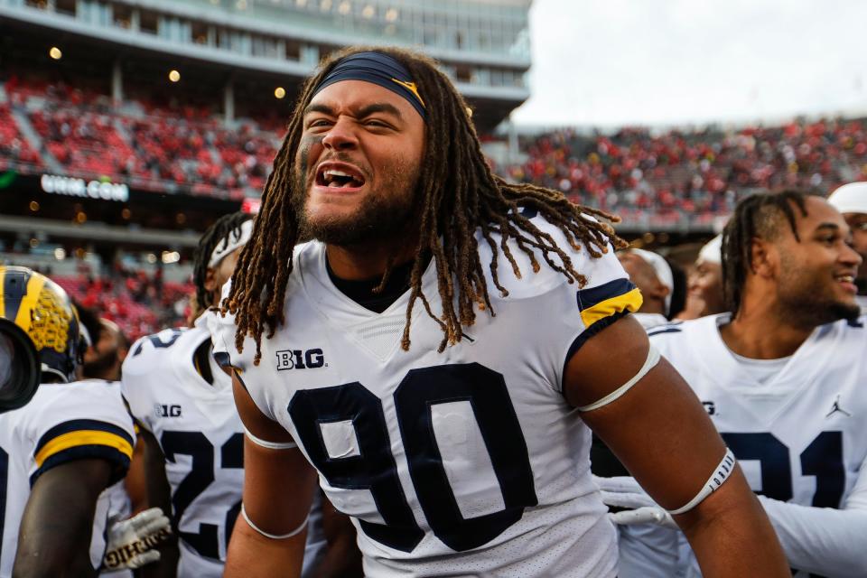 Michigan linebacker Mike Morris (90) celebrates the Wolverines' 45-23 win  Saturday, Nov. 26, 2022 over Ohio State at Ohio Stadium in Columbus.