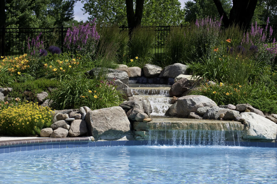 'Cause nothing said fancy pool like rocks and a waterfall!