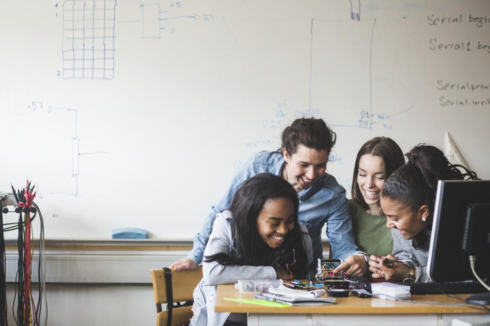 students work in a group on a project in class