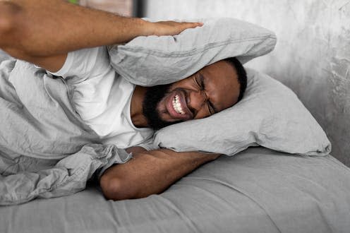 <span class="caption">People with tinnitus are more likely to have disturbed sleep. </span> <span class="attribution"><a class="link " href="https://www.shutterstock.com/image-photo/cant-sleep-portrait-irritated-young-black-2049529997" rel="nofollow noopener" target="_blank" data-ylk="slk:Prostock-studio/ Shutterstock;elm:context_link;itc:0;sec:content-canvas">Prostock-studio/ Shutterstock</a></span>