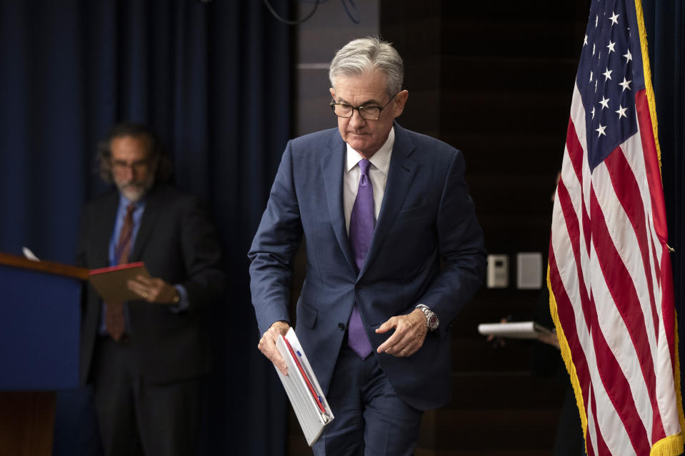Federal Reserve Chairman Jerome Powell walks to the podium during a news conference following a two-day Federal Open Market Committee meeting in Washington, Wednesday, July 31, 2019. The Federal Reserve cut its key interest rate Wednesday for the first time in a decade to try to counter threats ranging from uncertainties caused by President Donald Trump's trade wars to chronically low inflation and a dim global outlook. (AP Photo/Manuel Balce Ceneta)