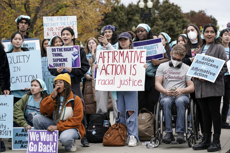 FILE - Activists demonstrate as the Supreme Court hears oral arguments on a pair of cases that could decide the future of affirmative action in college admissions, in Washington, Oct. 31, 2022. As the Supreme Court decides the fate of affirmative action, most Americans say the court should allow consideration of race as part of the admissions process, yet few believe students' race should play a significant role in decisions. (AP Photo/J. Scott Applewhite, File)