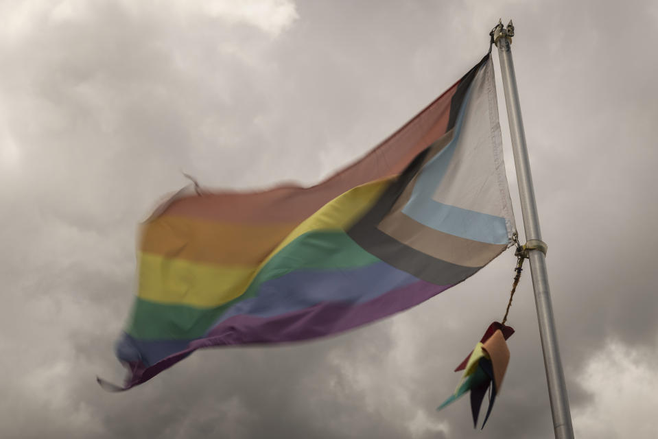 A pride flag is flown outside Club Q, the LGBTQ nightclub that was the site of a deadly 2022 shooting that killed five people, on Wednesday, June 7, 2023 in Colorado Springs, Colo. (AP Photo/Chet Strange)