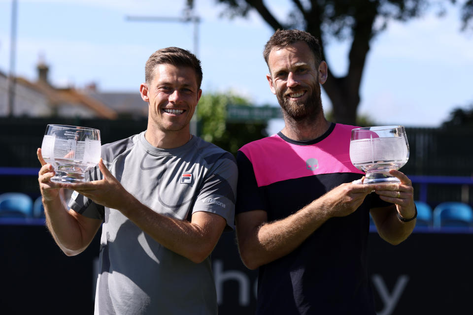 Neal Skupski and Michael Venus with their winners trophies at Eastbourne (Photo by Charlie Crowhurst/Getty Images for LTA)