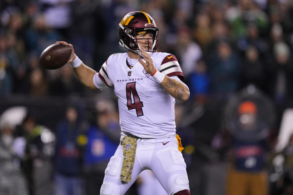 Washington Commanders quarterback Taylor Heinicke (4) throws a pass during the second half of an NFL football game against the Philadelphia Eagles, Monday, Nov. 14, 2022, in Philadelphia. (AP Photo/Matt Slocum)