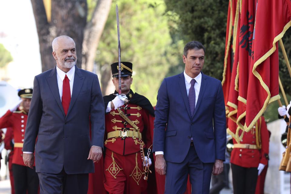 Spain's Prime Minister, Pedro Sanchez, right, and his Albanian counterpart Edi Rama review the honor guard during the welcoming ceremony at the government headquarters in Tirana, Albania, Monday, Aug. 1, 2022. Sanchez is in Albania for a one-day official visit. (AP Photo/Franc Zhurda)