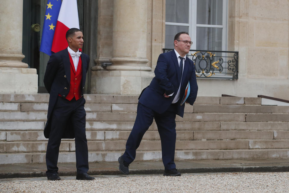 FILE - New French Minister of Solidarity Damien Abad, right, leaves the Elysee Palace after the first cabinet meeting since French President Emmanuel Macron 's reelection, Monday, May 23, 2022 in Paris. Rape accusations against Damien Abad have galvanized a movement aimed at exposing sexual misconduct in French politics and encouraging women to speak out against abusers. Abad strongly denied the accusations. (AP Photo/Michel Spingler, File)