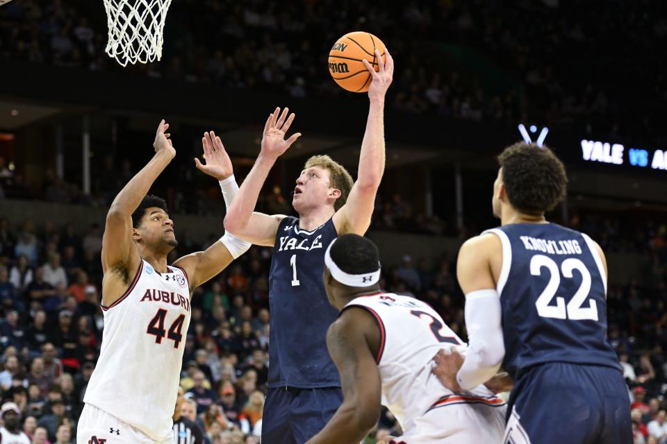 Yale forward Danny Wolf (1) attempts a basket against Auburn center Dylan Cardwell (44) during the first round of the 2024 NCAA men's tournament at Spokane Veterans Memorial Arena.