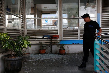 A security officer walks near the scene of an explosion at a bus station in Kampung Melayu, Jakarta, Indonesia May 25, 2017. REUTERS/Darren Whiteside