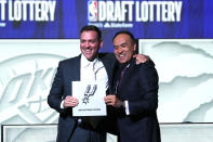 San Antonio Spurs managing partner Peter J. Holt, left, stands with NBA Deputy Commissioner Mark Tatum after Tatum announced that the Spurs had won the first pick in the NBA draft, at the draft lottery in Chicago, Tuesday, May 16, 2023. (AP Photo/Nam Y. Huh)