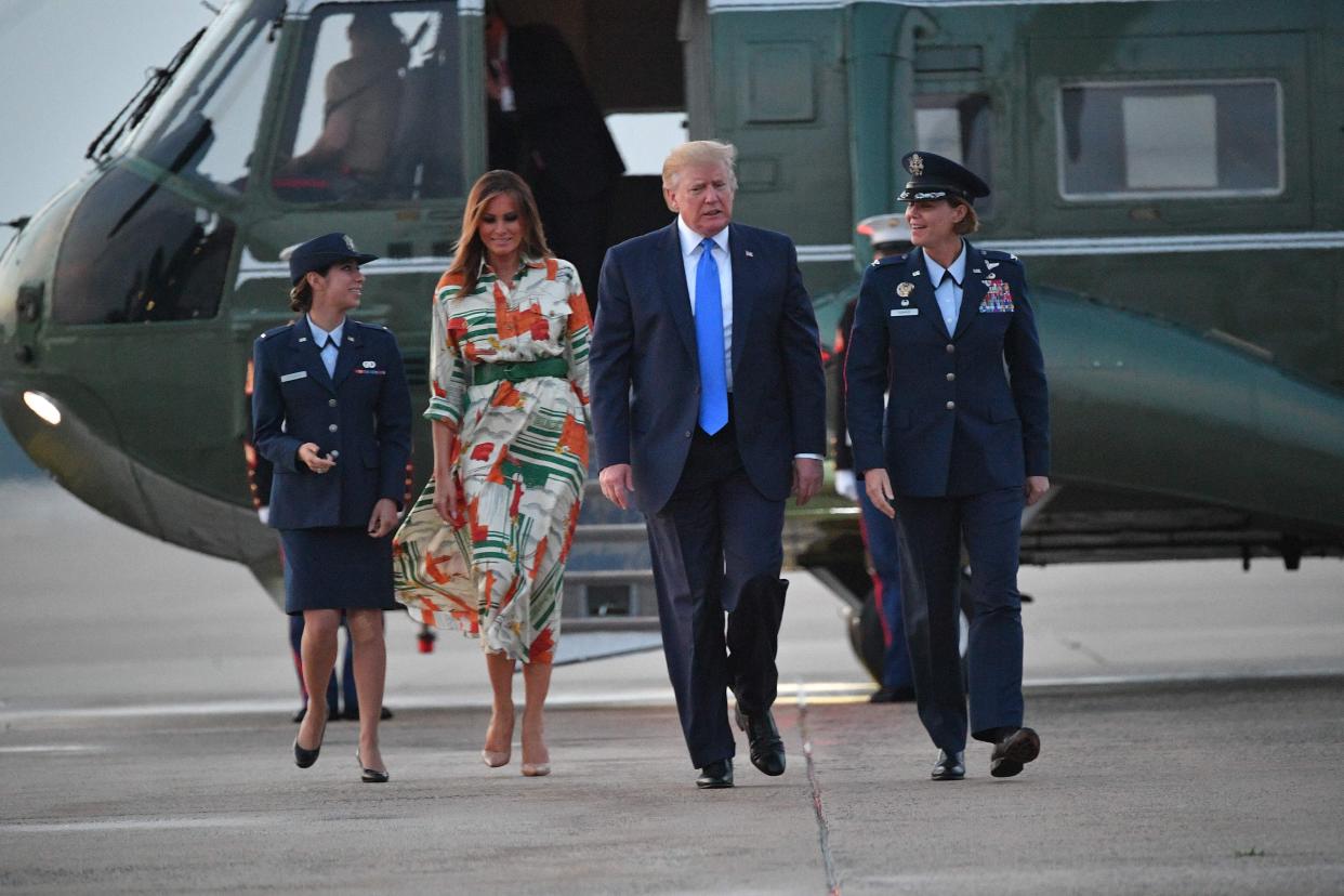 US President Donald Trump and First Lady Melania Trump stepped off Marine One and make their way to board Air Force One before departing from Andrews Air Force Base in Maryland on June 2, 2019. - US President Donald Trump is flying to England for a three-day state visit. (Photo by MANDEL NGAN / AFP)        (Photo credit should read MANDEL NGAN/AFP/Getty Images)