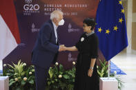 In this photo released by Indonesian Ministry of Foreign Affairs, European Union High Representative for Foreign Affairs and Security Policy Josep Borrell Fontelles, left, shakes hands with Indonesian Foreign Minister Retno Marsudi during their bilateral meeting ahead of the G20 Foreign Ministers' Meeting in Nusa Dua, Bali, Indonesia, Wednesday, July 6, 2022. Foreign ministers from the Group of 20 leading rich and developing nations are gathering in Indonesia's resort island of Bali for talks bound to be dominated by the conflict in Ukraine despite an agenda focused on global cooperation and food and energy security. (Indonesian Ministry of Foreign Affairs via AP)