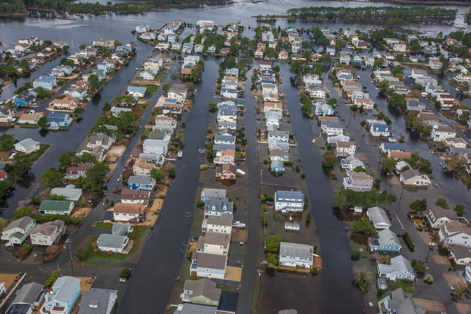 Floodwaters from superstorm Sandy surround homes in South Bethany, Del. Tuesday, Oct. 30, 2012. Sandy, the storm that made landfall Monday, caused multiple fatalities, halted mass transit and cut power to more than 6 million homes and businesses. (AP Photo/The Wilmington News-Journal, Robert Craig) NO SALES