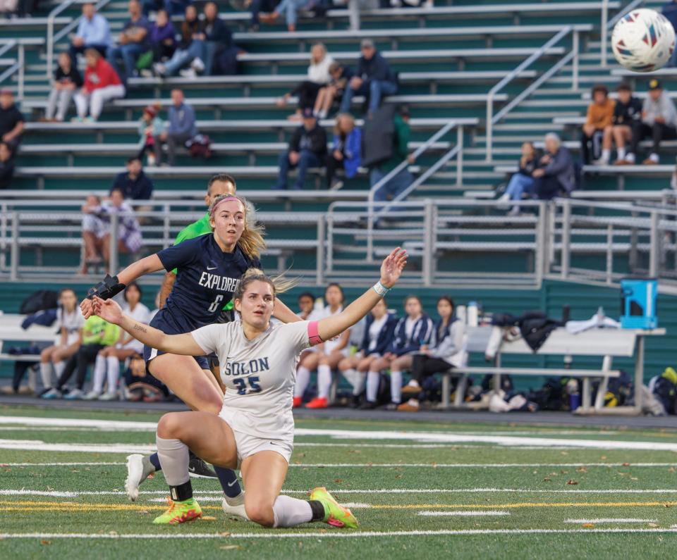 Hudson's Ava Bell watches a shot go wide around Solon's Mia Patriarco during the Division I district final Thursday at Nordonia.