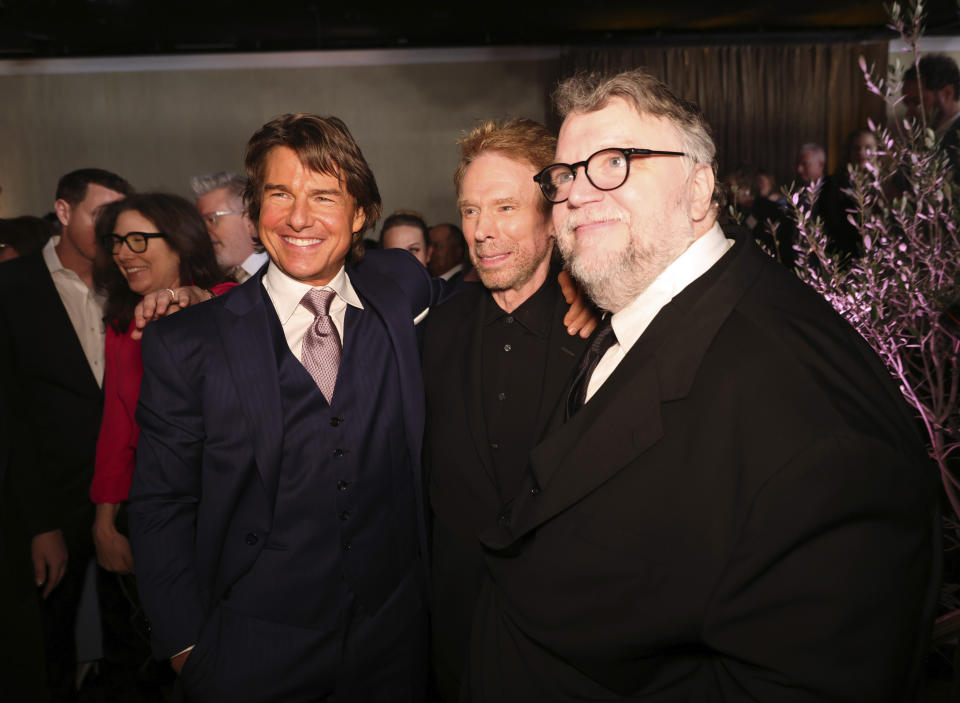 Tom Cruise, from left, Jerry Bruckheimer and Guillermo del Toro attend the 95th Academy Awards Nominees Luncheon on Monday, Feb. 13, 2023, at the Beverly Hilton Hotel in Beverly Hills, Calif. (Photo by Willy Sanjuan/Invision/AP)