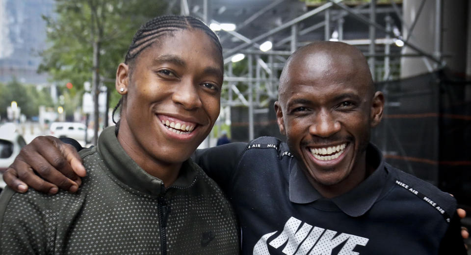 Caster Semenya, left, the current 800-meter Olympic gold and world champion from South Africa, with her coach Samuel Sepeng, right, during their visit to New York, Monday, Oct. 15, 2018. Semenya will receive the Wilma Rudolph Courage Award from the Women's Sports Foundation on Wednesday. (AP Photo/Bebeto Matthews)