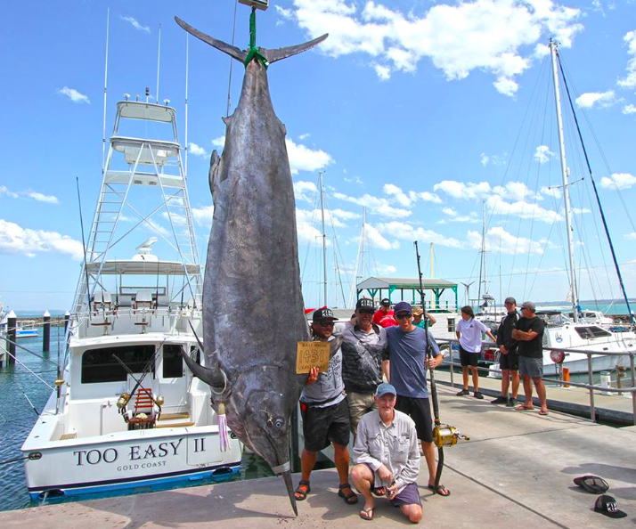 Fishermen pose with the giant catch. Source: Facebook/ Fishing with Scotto