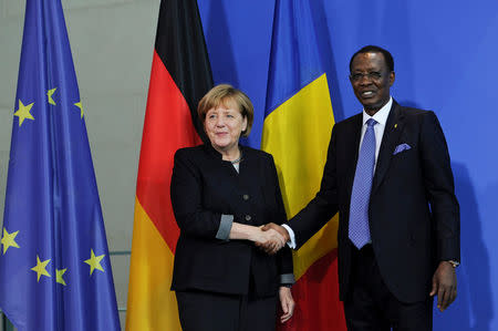 German Chancellor Angela Merkel and Chad President Idriss Deby shake hands after a news conference at the Chancellery in Berlin, Germany October 12, 2016. REUTERS/Stefanie Loos