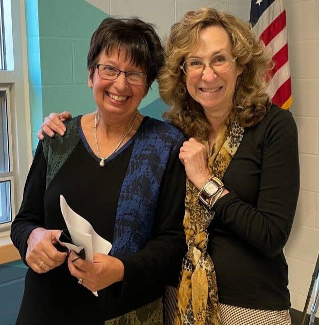 Hampton Falls Library Director Barbara Tosiano (left) poses for a photo with author Sy Montgomery.