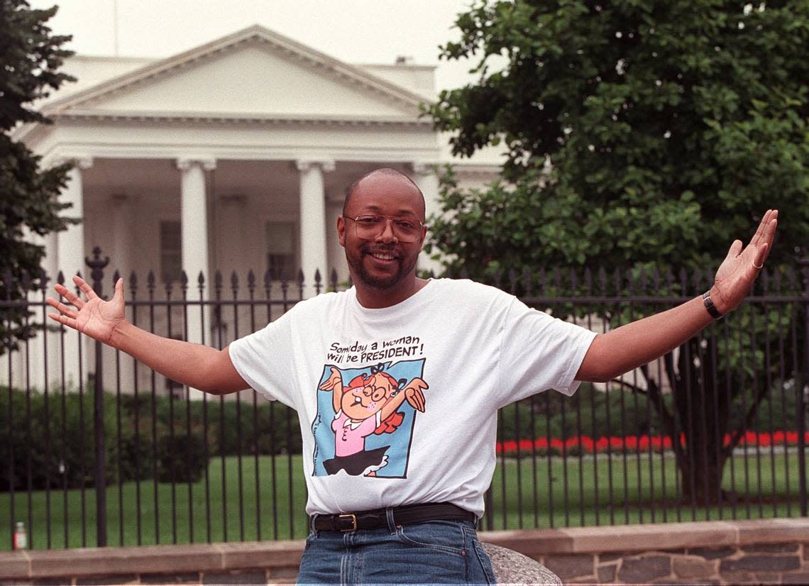 Leonard Pitts Jr. in front of the White House circa 2005 wearing a shirt that reads, “Someday a woman will be president.”