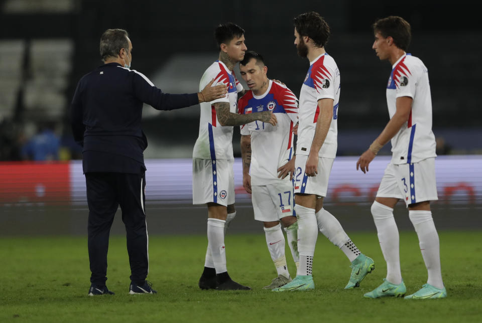 Chile's players leave the field at the end of a Copa America quarterfinal soccer match against Brazil at the Nilton Santos stadium in Rio de Janeiro, Brazil, Friday, July 2, 2021. Chile lost to Brazil 0-1. (AP Photo/Silvia Izquierdo)