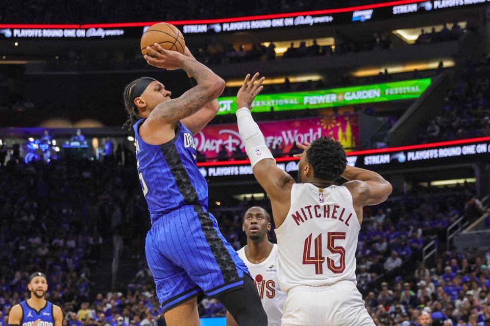 Magic forward Paolo Banchero shoots over Cavaliers guard Donovan Mitchell during the second quarter of Game 3 in the first round of the NBA playoffs, April 25, 2024, in Orlando.