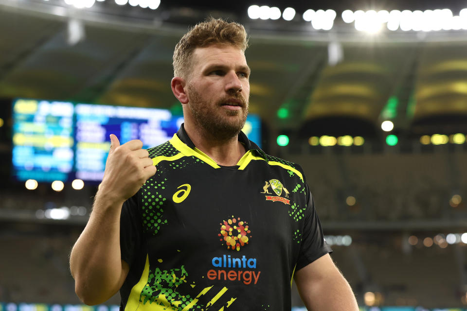 Aaron Finch (pictured) walks to the post match interview.