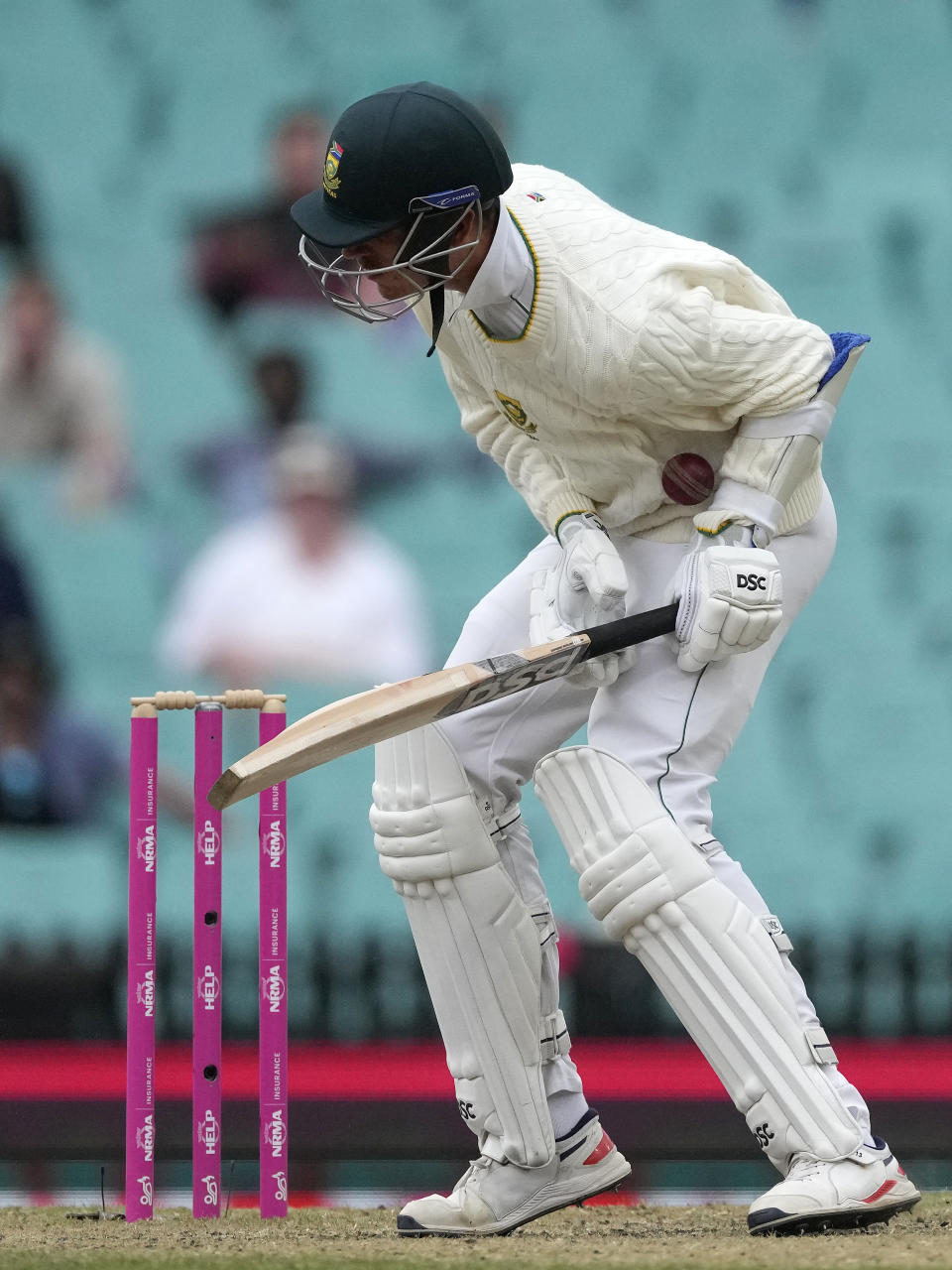 South Africa's Marco Jansen is struck by a delivery from Australia's Pat Cummins during the fourth day of their cricket test match at the Sydney Cricket Ground in Sydney, Saturday, Jan. 7, 2023. (AP Photo/Rick Rycroft)