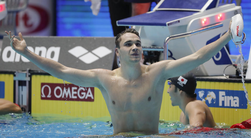 Hungary's Kristof Milak celebrates after winning the men's 200m butterfly final in a world record time at the World Swimming Championships in Gwangju, South Korea, Wednesday, July 24, 2019. (AP Photo/Lee Jin-man)