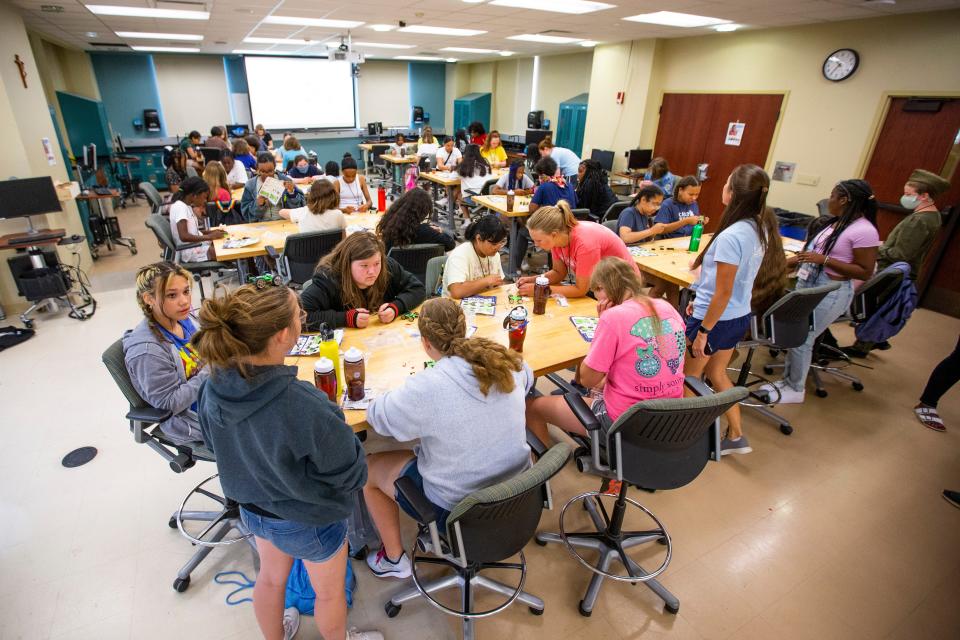 Students work on a solar-powered car during the GE Girls STEM Camp Wednesday, June 22, 2022, at Notre Dame.